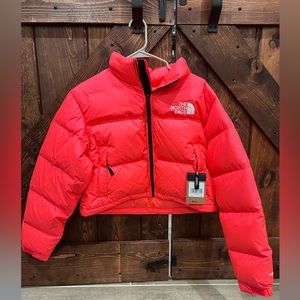 Brand new Northface Nuptse Short Jacket in Brilliant Coral with tags.
